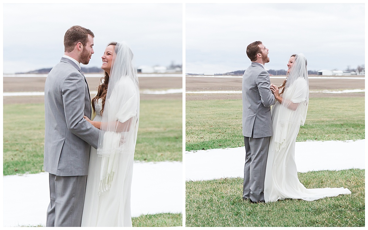 bride and groom laugh together sharing first look, in winter grassy area