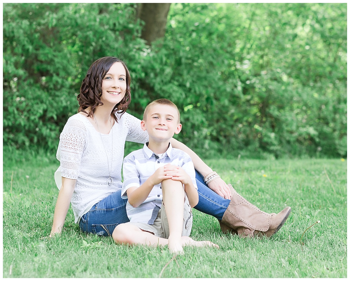 mother son in grassy area with trees