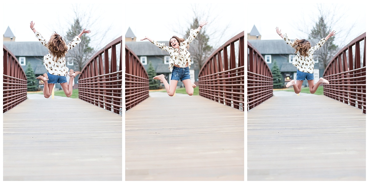 senior girl jumping on walking bridge