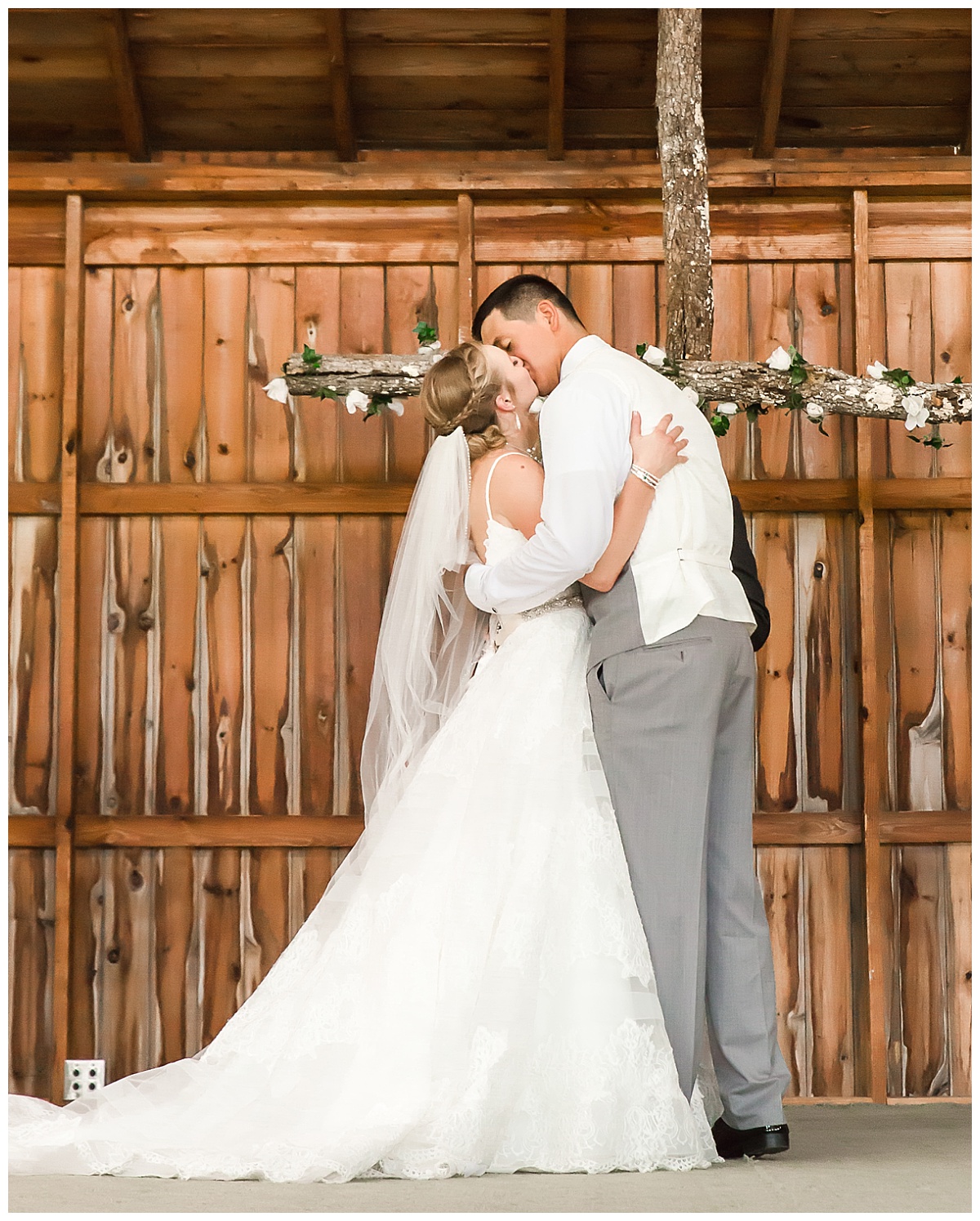 The Kiss Wedding ceremony bride and groom at rustic venue