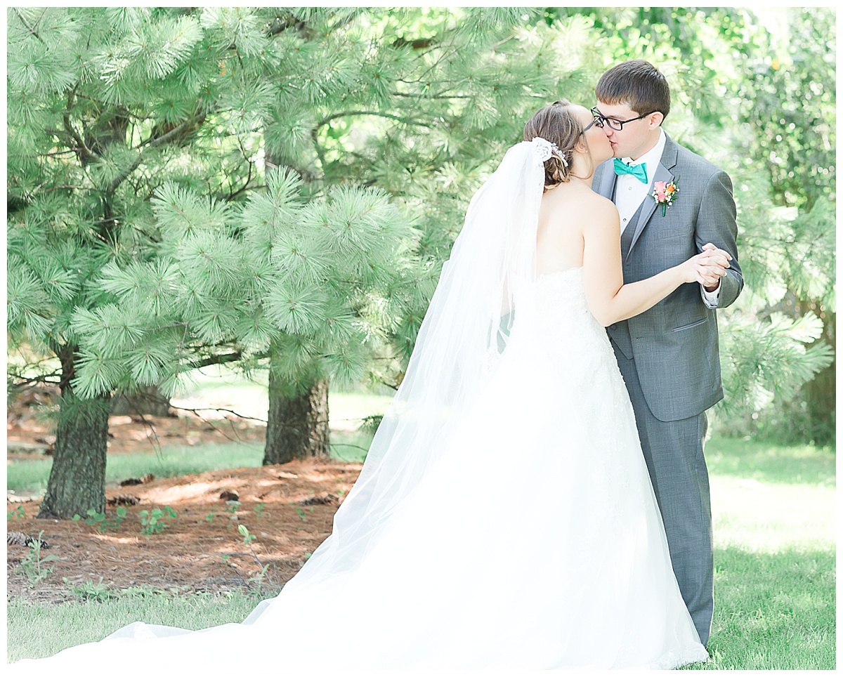 first look | bride and groom| teal and coral wedding with gray tux