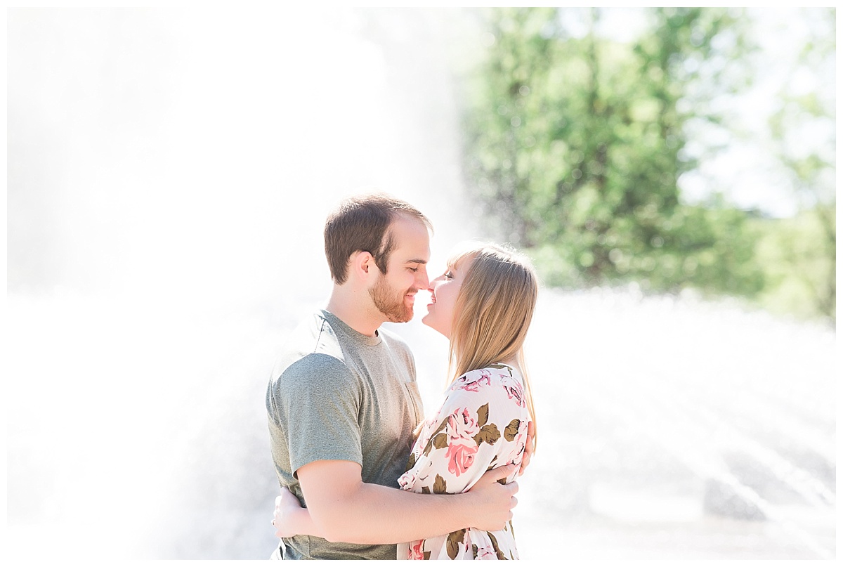 Couple in front of fountain at Purdue University engagement session 