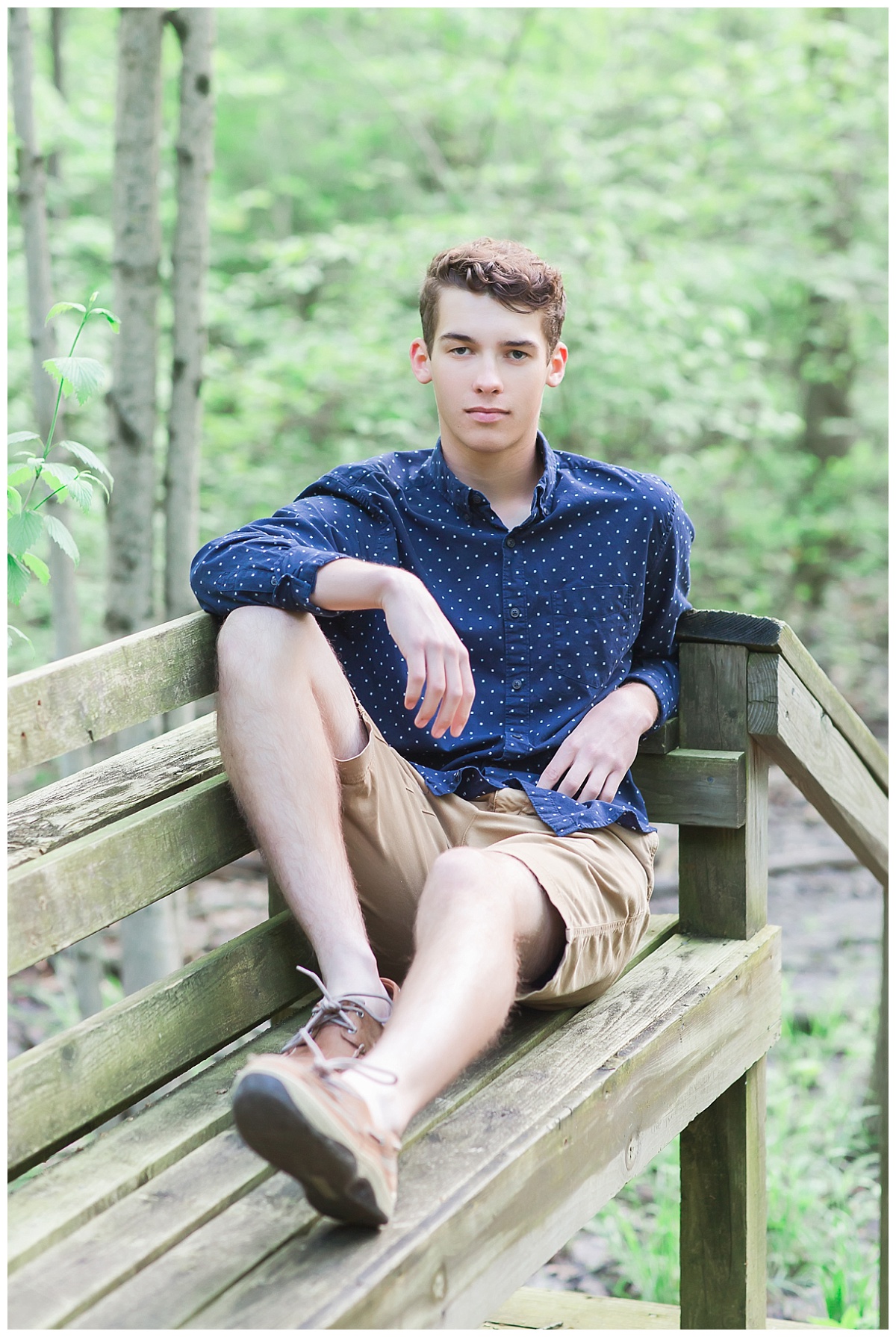 Senior guy bench in woods photo by Simply Seeking Photography