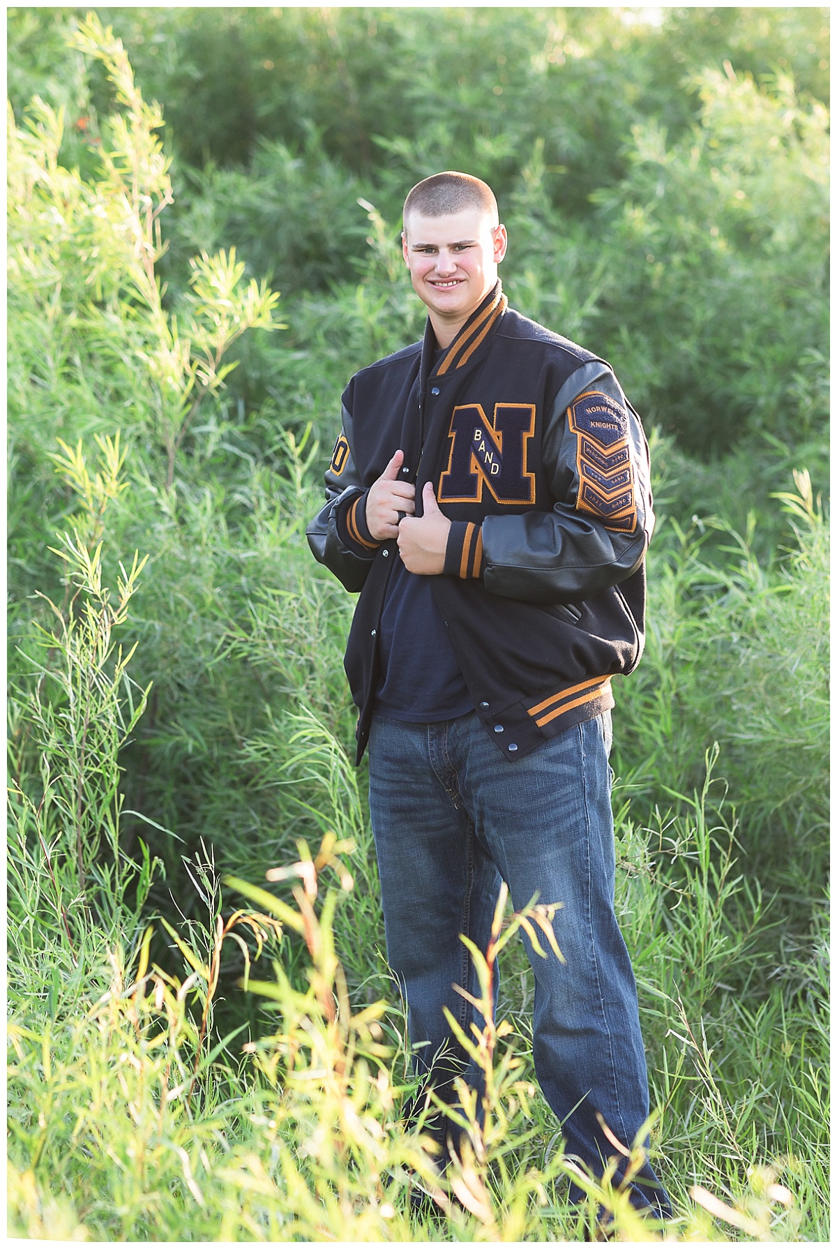 Senior guy in letter jacket photo by Simply Seeking Photography