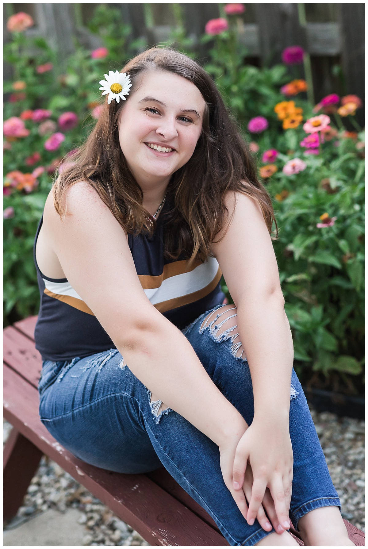 Senior girl in grandparents flower garden photo by Simply Seeking Photography