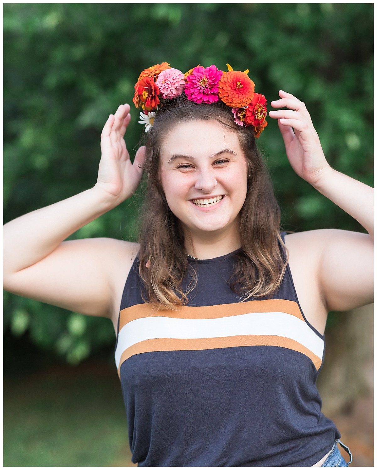 Senior girl wearing flower crown photo by Simply Seeking Photography