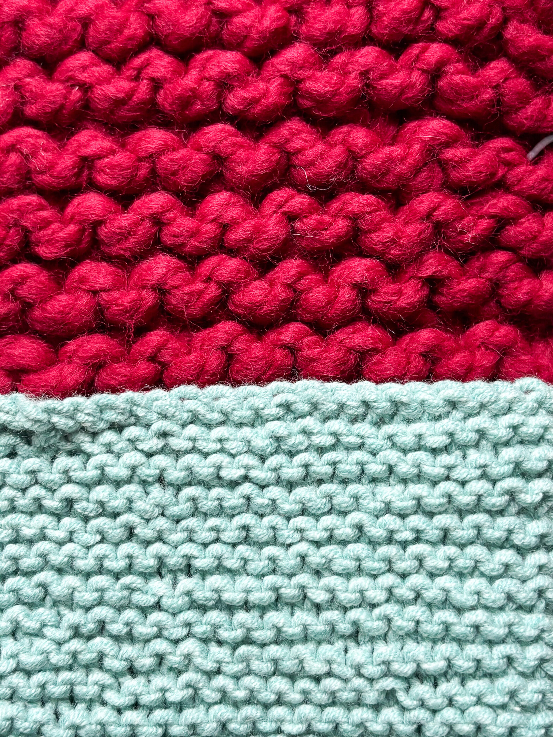 Knitting Basics Understanding Gauge. two knit pieces in garter stitch one using small yarn and needles, the other using thick yarn and large needles